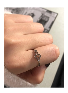 Detailed view of S925 sterling silver minimalist hollow cross ring on female hand