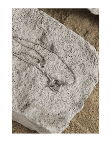 Macro detail of S925 sterling silver ball chain with minimalist liquid T-bar toggle clasp