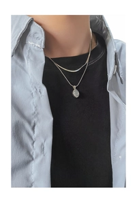 Detail of silver S925 double layer moonstone necklace worn on a mannequin model