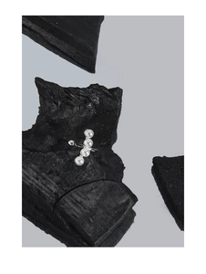 Detail view of S925 silver ear cuff with four small white pearls on black stone
