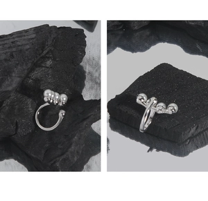 Detail view of S925 sterling silver ear clips with a row of small elegant white pearls