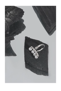 Macro detail of minimalist S925 silver ear cuff featuring four lustrous round pearls
