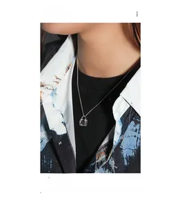 Close-up of S925 sterling silver necklace with a clear square zircon pendant on neck