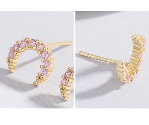 Detailed view of S925 silver hallmark on gold-plated pink zircon crescent earrings
