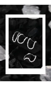 Detailed view of S925 sterling silver textured ring with minimalist wavy faceted design