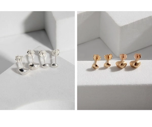 Macro detail of irregular S925 sterling silver stud earrings in gold and silver finish