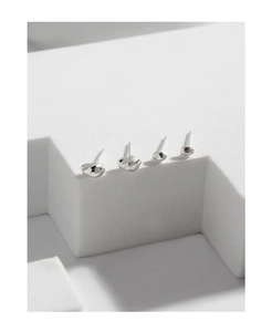 Macro detail of irregular S925 silver pebble earrings showing organic shapes and texture