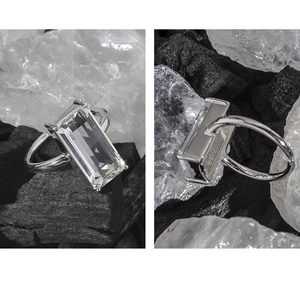 Macro view of S925 sterling silver ring featuring a clear emerald-cut zircon stone