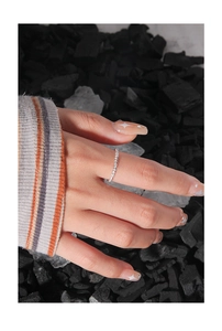 Close-up of S925 sterling silver eternity ring with pave-set zircon on model's hand