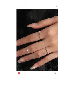 Detailed view of 1mm S925 sterling silver textured rings with engraved floral patterns