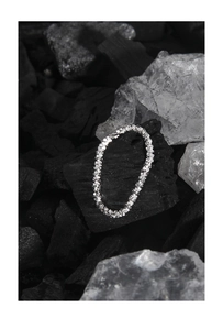 Macro view of textured S925 sterling silver chain ring with a sparkling finish