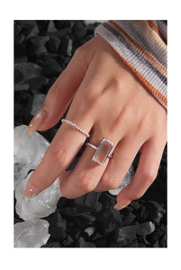 Close-up of minimalist S925 sterling silver ring set with rectangular zircon on hand