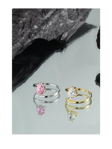 Close-up of S925 silver rings with pear-cut pink and white zircons on mirror base