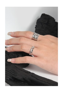 Detail of S925 silver irregular lava ring with micro-set zircon and relief texture finish