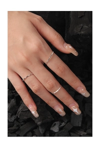 Detailed close-up of 1mm S925 sterling silver minimalist rings with textured finish