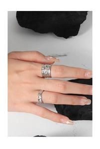 Detailed shot of S925 sterling silver rings with irregular texture and micro zircon inlay