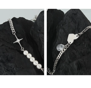 Macro detail of S925 silver necklace with pearls, heart charm and star pendant