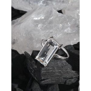 Minimalist S925 sterling silver ring with emerald cut zircon on black charcoal base