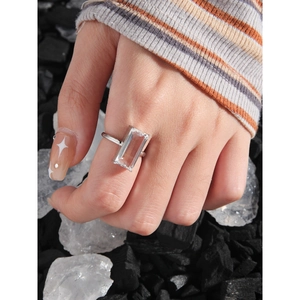 Minimalist S925 sterling silver ring with a large rectangular zircon on a modern stone backdrop