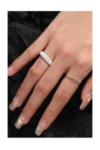 Detailed close-up of 1mm textured and frosted S925 sterling silver rings on hand