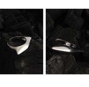 Macro detail of S925 sterling silver stamp on the irregular geometric open ring band