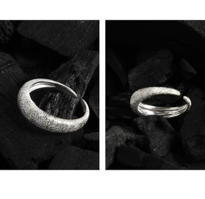 Macro detail of S925 sterling silver ring showing sandblasted texture and hallmark