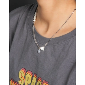 S925 sterling silver necklace with heart pendant and pearls shown on a female model