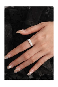 Detailed close-up of S925 sterling silver ring with textured frosted sand finish on model