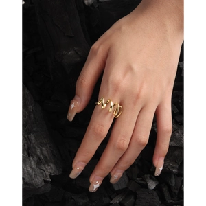 Minimalist golden wavy spiral ring for women shown on a hand with dark charcoal background