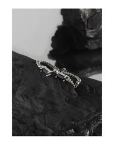 Macro shot of S925 silver chain earrings featuring dual black square zircon stones