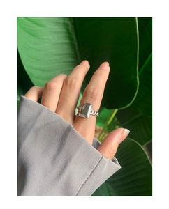 Detailed view of an S925 sterling silver liquid chain ring worn on a finger