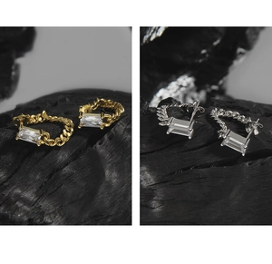 Detail of S925 sterling silver chain stud earrings with emerald-cut cubic zirconia