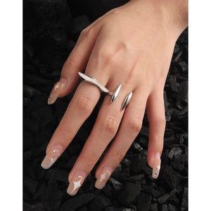 Irregular geometric S925 sterling silver open ring on charcoal stone background