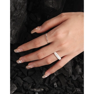 S925 sterling silver ring set with textured sand finish and slim band on model hand