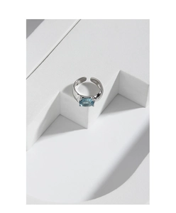Detailed close-up showing the S925 silver hallmark and oval blue zircon on the ring band