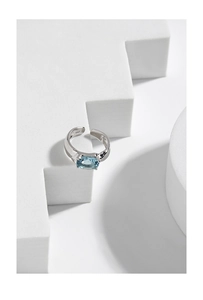 Close-up of S925 sterling silver hallmark and oval blue zircon on the ring band