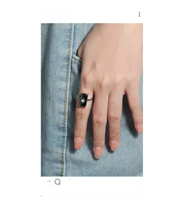 Close-up of S925 silver ring featuring a black rectangular stone with a silver star