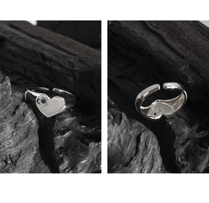 Macro detail of silver heart ring with micro zircon and adjustable open band structure