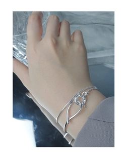 Detail of S925 sterling silver double-layer snake bone bracelet on female wrist