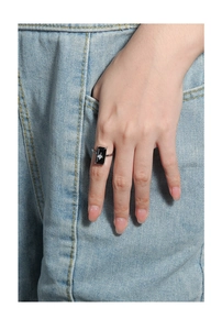 Detail of S925 silver ring featuring a rectangular black stone with a tiny center star