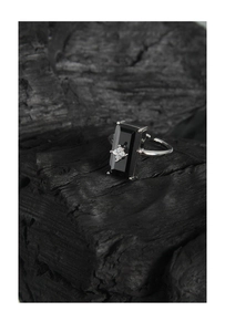 Detail of S925 silver ring featuring a black rectangular stone with a central zircon