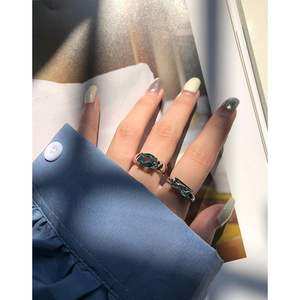 Elegant S925 sterling silver ring featuring a blue oval zircon on a stylish hand model