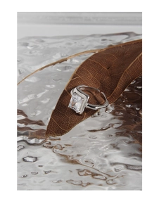 Macro shot of S925 sterling silver stamp and zircon setting on an adjustable ring