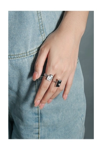 Detailed macro view of S925 silver geometric ring with black and white inlay and small diamonds