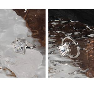 Macro shot of silver S925 ring with rectangular zircon and irregular band detail