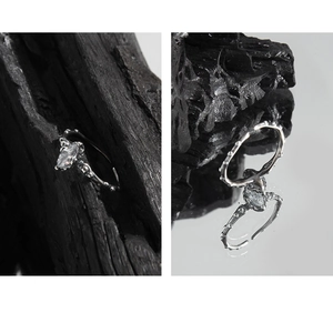 Detail view of S925 silver ring with marquise-cut zircon and vintage vine texture