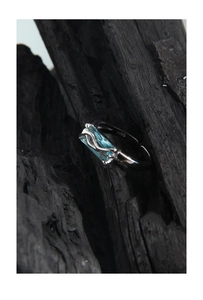 Macro detail of S925 sterling silver ring featuring a light blue rectangular zircon stone