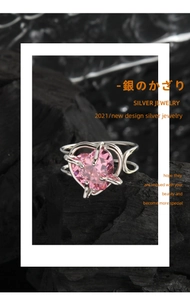 Macro detail of S925 silver ring featuring a pink heart-shaped cubic zirconia stone