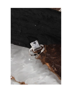 Macro shot of S925 silver ring featuring a rectangular zircon and irregular texture