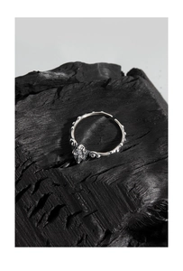Macro shot of vintage S925 silver ring with marquise zircon on a charcoal background
